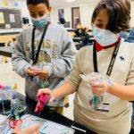 middle school kids making kindness rocks