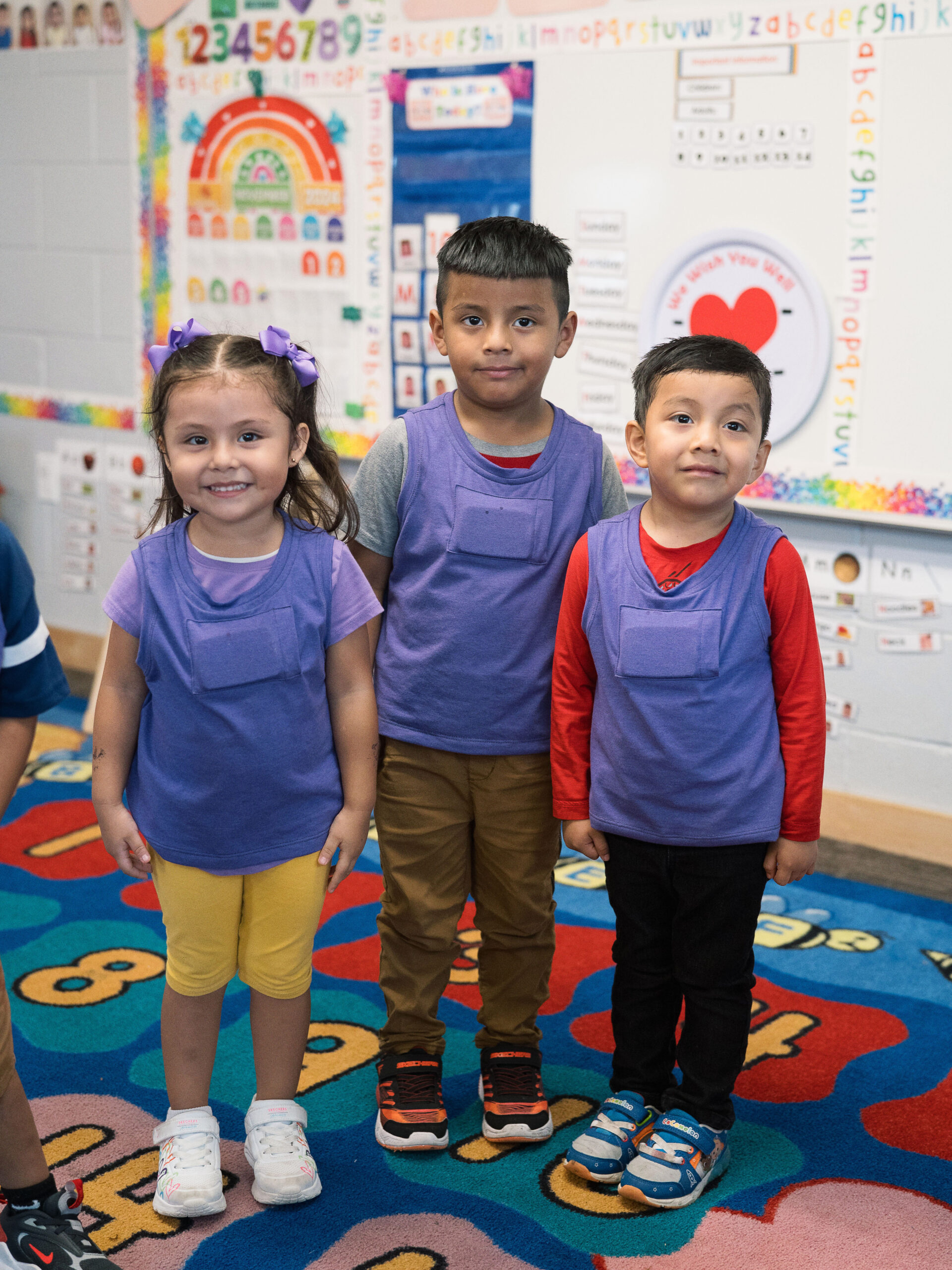 Children wearing Lena vests